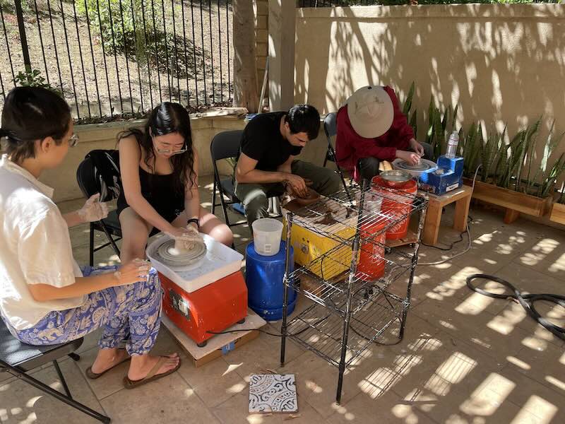 Participants working on pottery