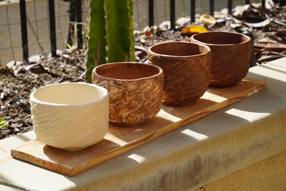 Participants shaping their matcha bowls